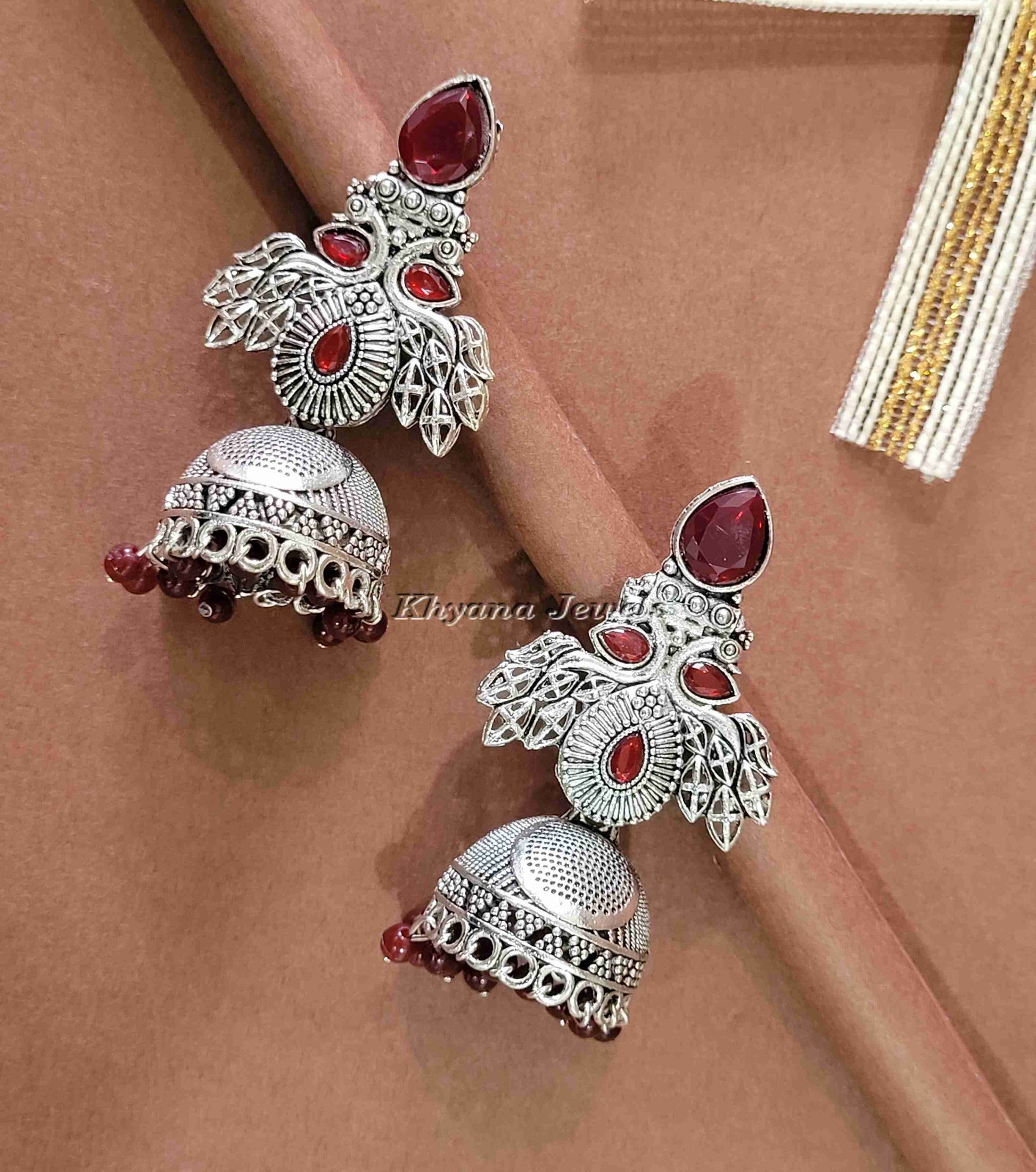 Ornate Oxidised Silver Jhumkas with Ruby Stones