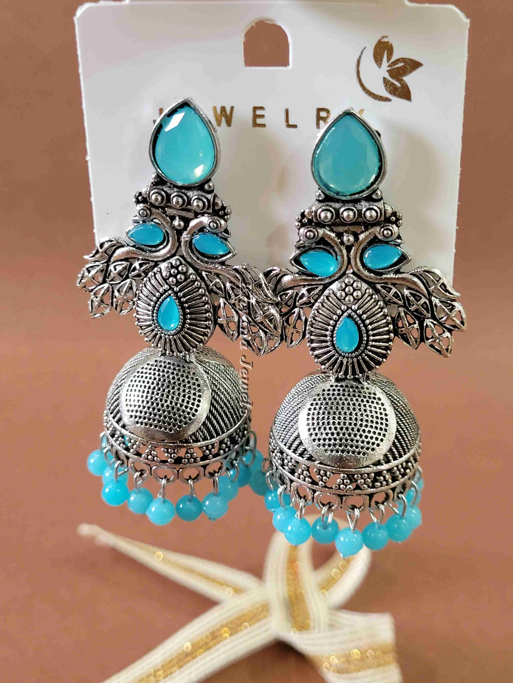Ornate Oxidised Silver Jhumkas with Ruby Stones