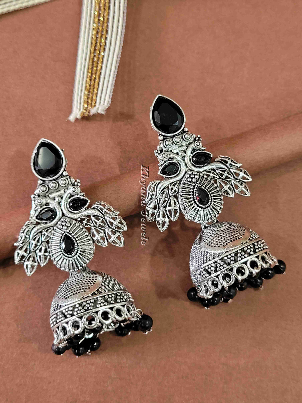 Ornate Oxidised Silver Jhumkas with Ruby Stones