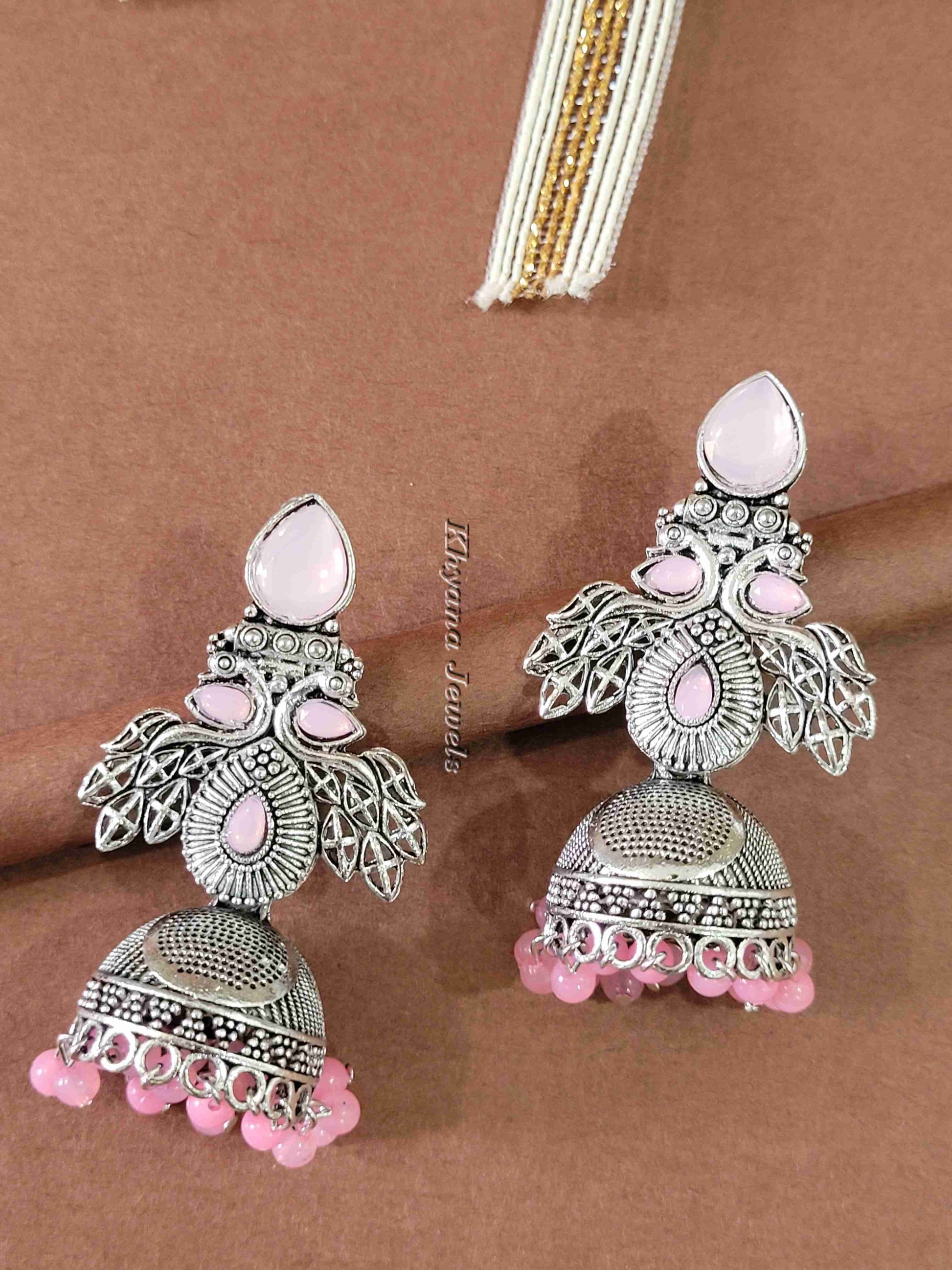 Ornate Oxidised Silver Jhumkas with Ruby Stones
