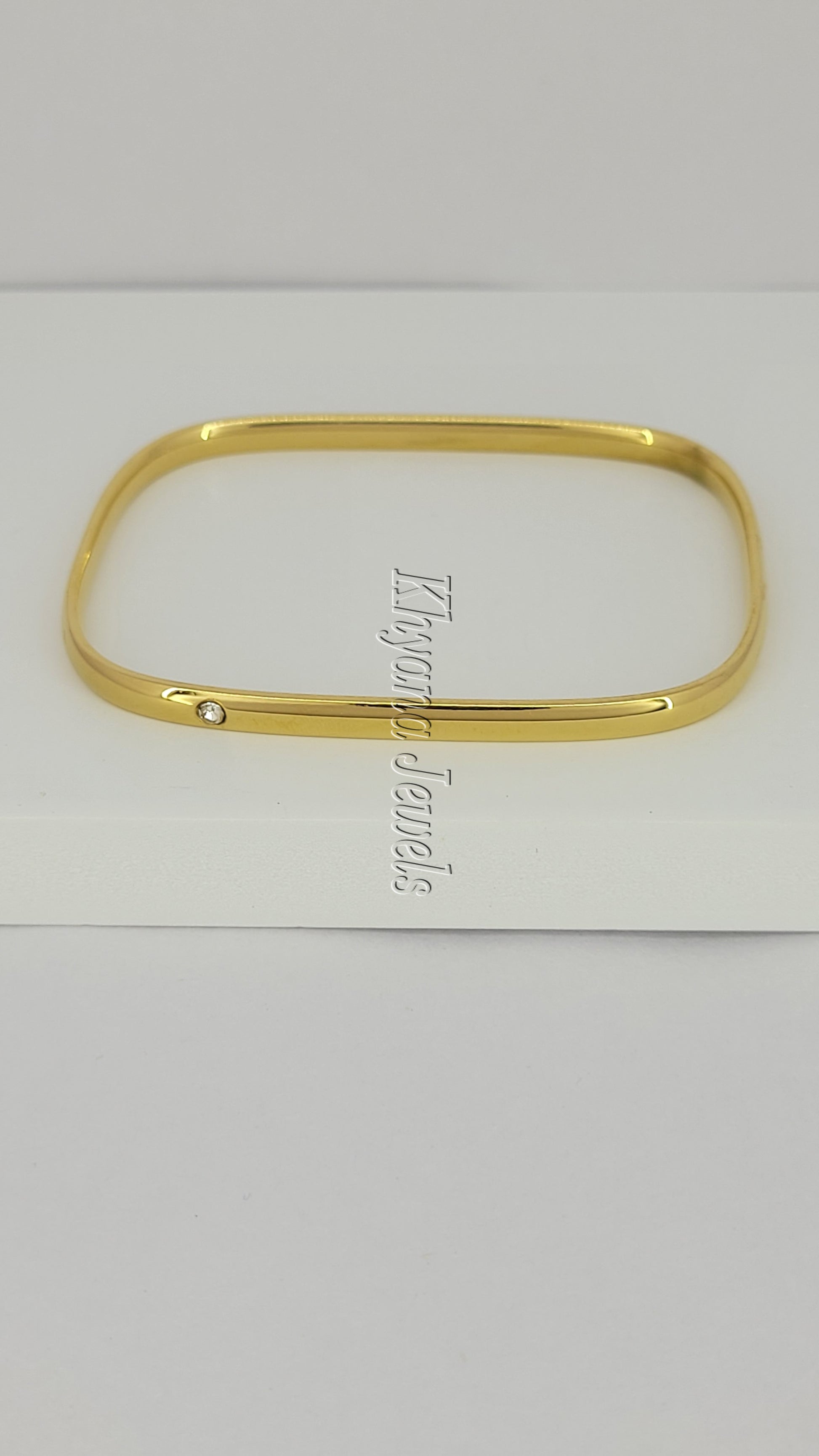 Slim Gold Plated Square Bangle with Single Stone Accent